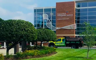Custom truck at commercial landscaping property